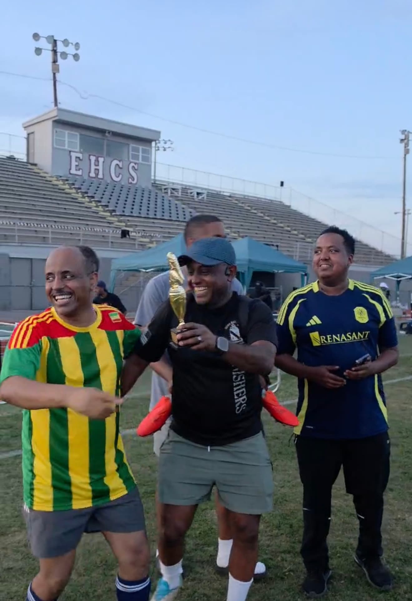 Ethio Unity members celebrating with a soccer trophy